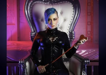 1. Alternative text: Woman with blue hair in a black latex outfit sitting on a silver throne.